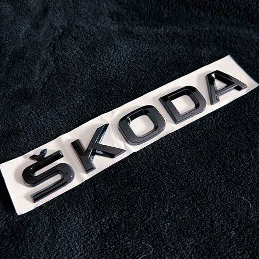 Monogramme/Logo/Badge Skoda noir brillant